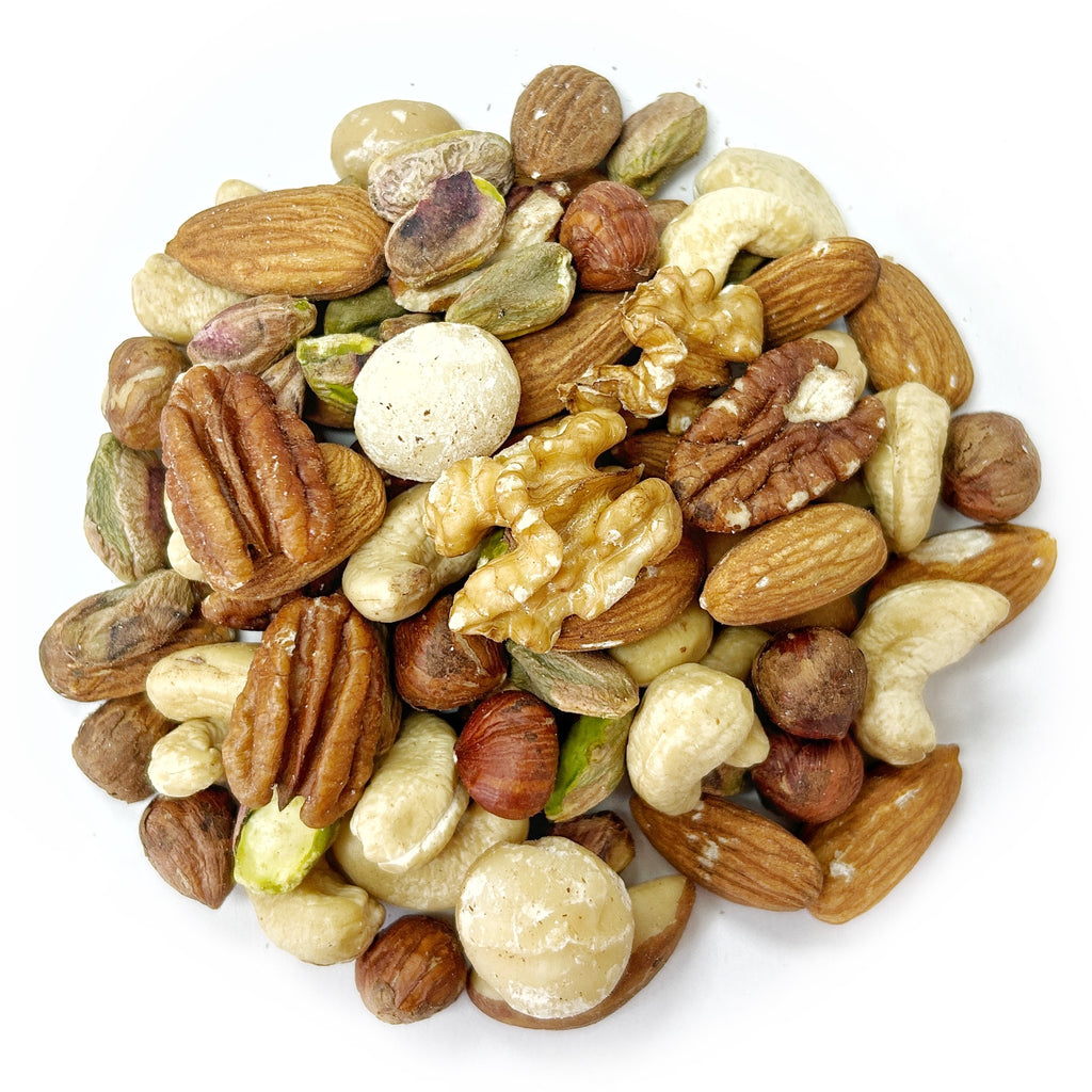 The Deluxe Mixed Raw Nuts features a blend of various raw mixed nuts, such as almonds, walnuts, cashews, hazelnuts, pecans, pistachios, and macadamia nuts on a white background. This nutritious snack is free from added salt or oil.