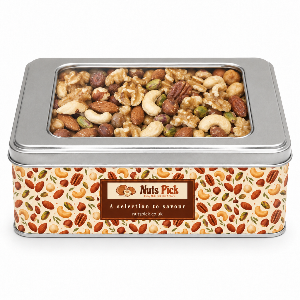 Raw Mixed Nuts In A Tin, a rectangular metal tin with a clear lid and nut illustrations, featuring a label reading “Nuts Pick, A selection to savour.”
