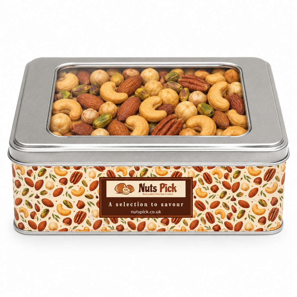 A Premium Mixed Nuts Tin (Roasted, Salted) with a clear lid, featuring a label with a nut-patterned background and the text “Nuts Pick, A selection to savour, nutspick.co.uk.”