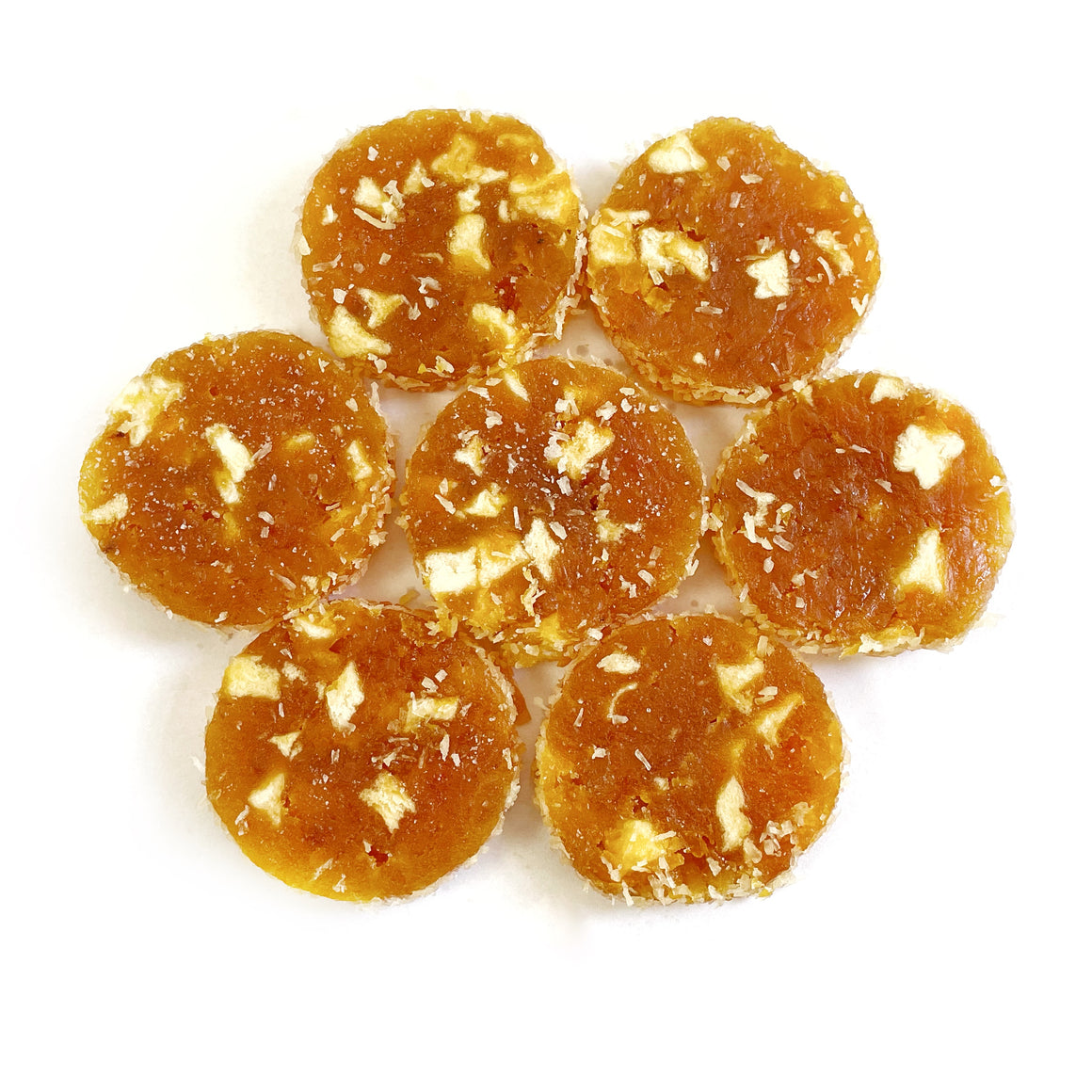 A group of Apricot & Apple Bites on a white surface.